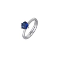 Adjustable silver spinner ring with a round claw-set dark blue gemstone on white background - Prong-Set Deep Blue Stone Style (22)