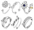 Set of six silver fidget rings with rotating beads and floral designs for anxiety relief - Anxiety Ring Set A (27)