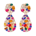 Detailed view of colorful rhinestones and multi-shape crystals on bohemian earrings - Colorful