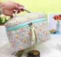 Quilted floral makeup bag in light blue and yellow cotton with mint green zipper handle - Sanitary Napkin Bag / Green Floral