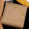 Elegante bracciale in acciaio al titanio dorato con pavé di zirconi e maglia a catena - Oro con zircone bianco