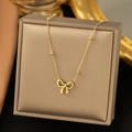 Elegant gold bow pendant necklace with micro-beads on a delicate polished chain - 【h1045】bow Necklace Gold