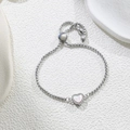 Detailed macro view of silver heart bracelet with pearl center and adjustable slider clasp - White Heart (Steel Color) (D180)