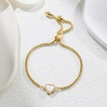 Detail of adjustable gold box chain bracelet with mother of pearl heart charm and zircons - White Heart (Gold Color) (D180)