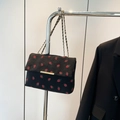 Detail of black corduroy shoulder bag with red strawberry embroidery and gold chain - Black