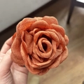 Macro view of orange fabric rose hair claw with detailed linen texture and petals - 9cm Orange