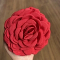 Detailed close-up of a red fabric rose hair claw clip with layered 3D camellia flower petals - 12cm / Red