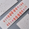 3D floral almond press-on nails with peach and heart patterns on white display stand - Peach Gradient Heart Style (WY-099)