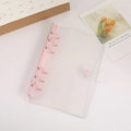 Transparent PVC A5/A6 6-hole binder with pink metal rings and snap closure - A6 / Nude Pink
