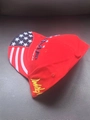 Red baseball cap featuring Trump embroidery and American flag pattern on the brim - 009 Stars Red