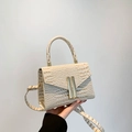 Beige faux crocodile skin handbag with gold metal accents and detachable crossbody strap - Off White