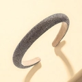 Wide padded headband with dark grey charcoal rhinestones on minimalist yellow steps - Dark Gray