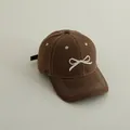 Deep brown kids baseball cap with 3D white bow embroidery in minimalist Japanese style - Brown