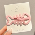 Pink fishbone hair clip for girls with a pearlescent finish on a white display card - Fishbone Style / Approx 7cm / Pink