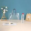 Transparent PVC daisy gift bag featuring stylish grey-blue leather handles and stitching - Blue Transparent