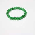 Detailed macro shot of green cat's eye stone beads showing unique light reflection - Green Cat's Eye Bracelet 8mm