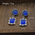 Retro style blue gemstone drop earrings in vintage silver frame, measuring 4.8cm length - Blue Faceted Gem Vintage Carved Dangle (Silver Post-490)