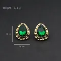 Vintage style gold teardrop earrings with green faceted stone and textured edges - Gold Ridged Edge Green Faceted Gem Studs (Silver Post-453)