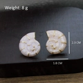 Pink marbled snail earrings with golden spiral details on a wooden background - Pink Cloud Pattern Conch Spiral Studs (Silver Post-452)