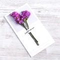 Detail of purple dried flowers fixed on a white gift card with Especially for you text - Red Forget-me-not Dried Flower Style