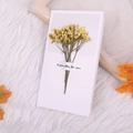 Detail of greeting card with dried yellow flowers and Especially for you text in warm setting - Yellow Crystal Grass Style