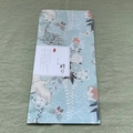 Detail of traditional Japanese envelope with crane patterns on green linen texture - Japanese Style Prayer and Sakura Pattern Style