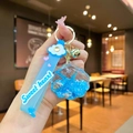 Dettaglio portachiavi con conchiglia blu, sabbia liquida, stella marina e cinturino Sweet heart - Cinturino Nuvola Bianca Blu Stella Marina Conchiglia
