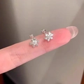 Detailed view of 925 sterling silver snowflake earrings with a secure screw-back design - Zirconia Snowflake (Pair) / Silver