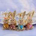 Set of four crystal rhinestone cartoon bunny keychains in gold metal finish - Random Color