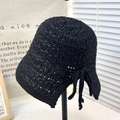 Women's black crochet bucket hat featuring hollow knit pattern and tassel tie accents - Tie-up Split Bucket Hat Black