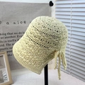 Crochet bucket hat in cream yellow featuring hollow weave design and decorative side bow - Tie-up Split Bucket Hat Cream White
