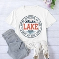 Flat lay of white T-shirt with 'What Happens at the Lake' print and blue jeans - L / White (Black Font)