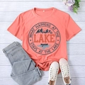 Flat lay of coral Lake T-shirt with blue denim jeans and white canvas shoes - S / Pink (Black Print)