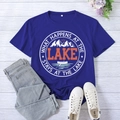 Flat lay of royal blue Lake print t-shirt paired with denim jeans and white sneakers - S / Retro Blue (White Font)