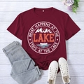 Flat lay of burgundy lake-themed t-shirt with vintage print and casual accessories - S / Wine Red (White Font)