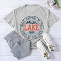 Flat lay of gray lake-themed t-shirt with orange typography and mountain graphic print - S / Light Gray (Black Font)