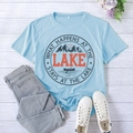 Flat lay of light blue T-shirt with lake print, jeans, and canvas shoes on wood background - S / Light Blue (Black Font)
