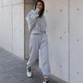 Detail of grey fleece tracksuit featuring cropped drawstring hoodie and high-waisted joggers - S / Top And Bottom / Light Gray