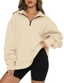 Detail view of cream half-zip oversized sweatshirt with contrast black zipper and soft fabric - S / Apricot