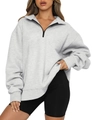 Detail of light gray oversized quarter-zip sweatshirt with black zipper and ribbed cuffs - S / Gray