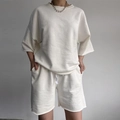 Women's minimalist white lounge set featuring loose crewneck top and drawstring shorts - S / White