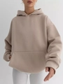Close-up of women oversized hoodie showing kangaroo pocket and ribbed cuffs detail - S / Khaki