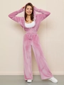 Detailed view of women pink velvet tracksuit with zip-up hoodie and high waist wide leg pants - S / Pink