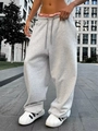 Dettaglio di pantaloni joggers grigio chiaro a gamba larga con coulisse e vestibilità comoda - S / Grigio