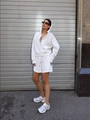 Profile view of model in white hooded sweatshirt and matching drawstring shorts set - S / White