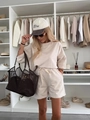 Detail of beige two-piece lounge set with drawstring shorts and oversized t-shirt - S / Apricot