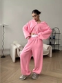 Pink lounge set featuring a cropped zip-up hoodie and wide-leg sweatpants in home setting - S / Top And Bottom / Pink