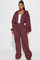Detail of burgundy lounge set featuring zip-up cropped hoodie and wide-leg joggers - S / Brick Red
