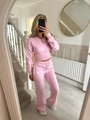 Detail showing the ribbed waist and zipper on this pink two-piece athleisure set - S / Pink