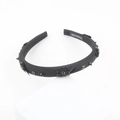 Detail of handmade black headband with beadwork flowers and white woven handmade label - Champagne (F)
